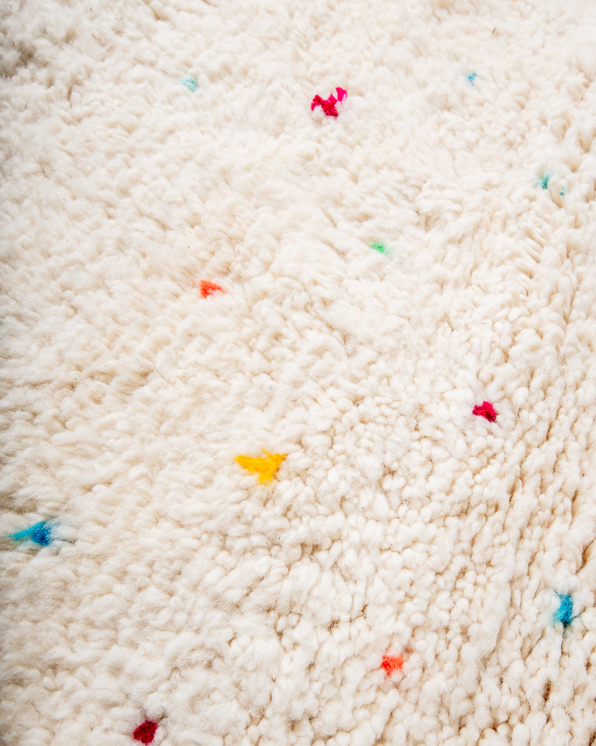 Modern, designer, handcrafted Berber rug from Morocco. Beniourain carpet with beautiful colours and patterns and fluffy wool texture.
